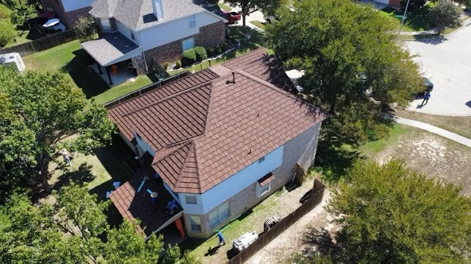 Drone view of a completed shingle roof replacement on a North Texas home